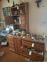 Overall view of hutch on top of cabinet and chest showing wood finish and hardware