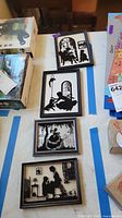 Four framed silhouette pictures grouped on table