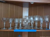 Group view of all etched stemware on shelf