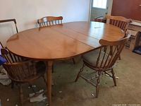 Top view of dining table and chairs showing overall style and finish