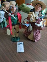 Both Byers Choice figurines side by side on table