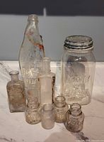 Group view of all eight vintage glass pieces