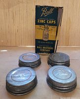 Four Ball zinc caps with original box front