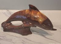 Right-side view of ceramic dolphin figurine