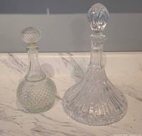 Front view of both decanters with stoppers in place