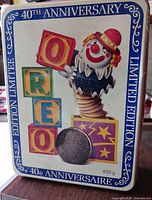Front view of Oreo 40th Anniversary tin showing clown graphic and capacity marking