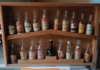 Full view of display case showing all miniature bottles