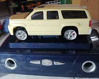 Left side view of Corgi SUV on mount
