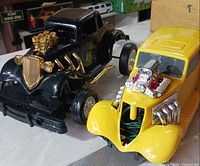 Both toy hot rods side by side showing overall appearance
