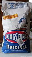 Front of Kingsford Original charcoal briquets bag showing logo and weight