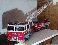 Full view of Tonka fire ladder truck with ladder extended