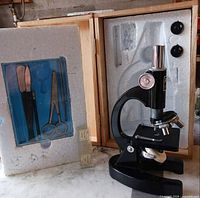 Microscope in case with accessory tray and slide boxes