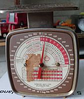 Front view of Zephyr postage scale showing dial and condition