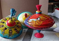 Three tops grouped showing graphics and plungers