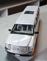 Front three-quarter view showing grille, hood and sunroof