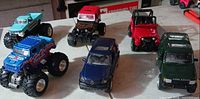 Front angled view of all six toy vehicles