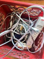 Crate contents including APC surge protector, cables, power strip