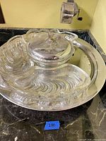 Top view showing glass inserts, metal lid and tray