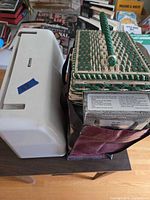 Kenmore machine with hard case, sewing basket, fabric bag visible