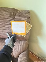 Brand tag on arm showing La-Z-Boy label and fabric texture