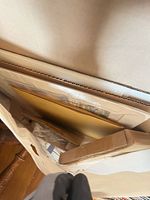 Top view of bag containing multiple flat artworks protected by cardboard sleeves