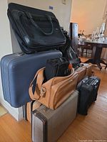 Stacked view of all six luggage pieces