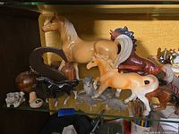 Overview of horses, wolves and letter S on shelf