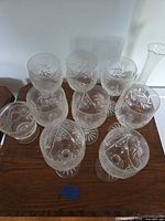 Group of stemmed wine glasses, dessert bowl and bud vase