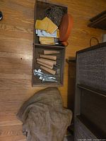 Overview of drawer with legs, webbing roll, envelopes, cord and burlap sack