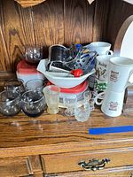 Full lot showing glasses, plastic containers, mugs, bowl and utensils