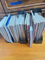 Row of magazines in three black holders