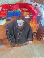 overall view: jacket, dragon decoration, slippers, envelopes