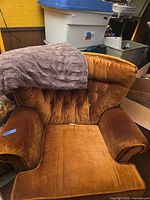 Front view of armchair with throw over backrest