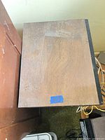 Top view of cabinet showing wood veneer surface and overall size