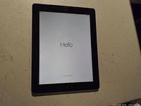 Front view with screen on displaying setup "Hello"