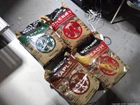 Front view of four sealed bags: Apple, Cherry, Maple, Peach