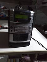 Front view showing model number LCX-330, control panel, cassette deck and display