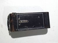 Camera closed, front face with Kodak nameplate, shows edge wear