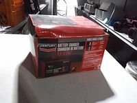 Century battery charger box showing branding and specifications