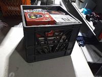 Side view of filled milk crate