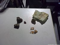 Group view of all eight mineral pieces on tabletop