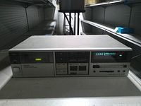 Front view showing brand, cassette bay, digital counter, controls