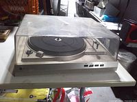 Front angled view showing entire turntable with dust cover