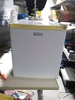 Front view of Emerson mini fridge closed