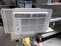 Front view showing grille, controls, side panels