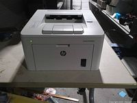 Front and left side view showing HP logo and power light on