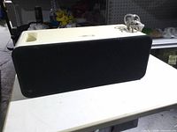 Front view showing black grille of Apple iPod Hi-Fi