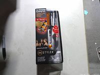 Front of sealed InStyler box showing brand, 3/4 inch barrel, As Seen On TV label