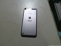 Back of iPod showing Apple logo, camera, LED flash, loop button