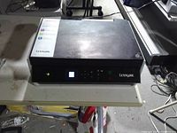 Printer closed front view showing control panel and branding